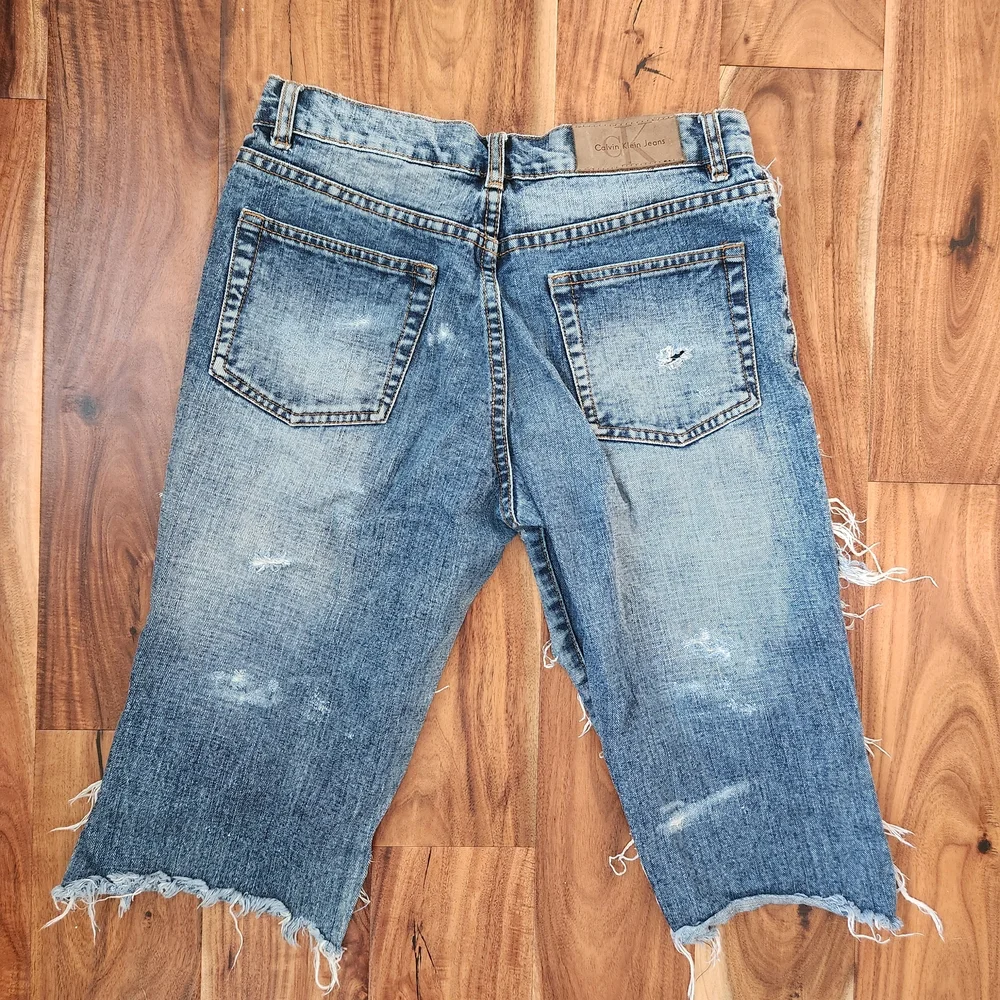 Vintage Calvin Klein Jeans Ripped Blue Jean Shorts, Size 28